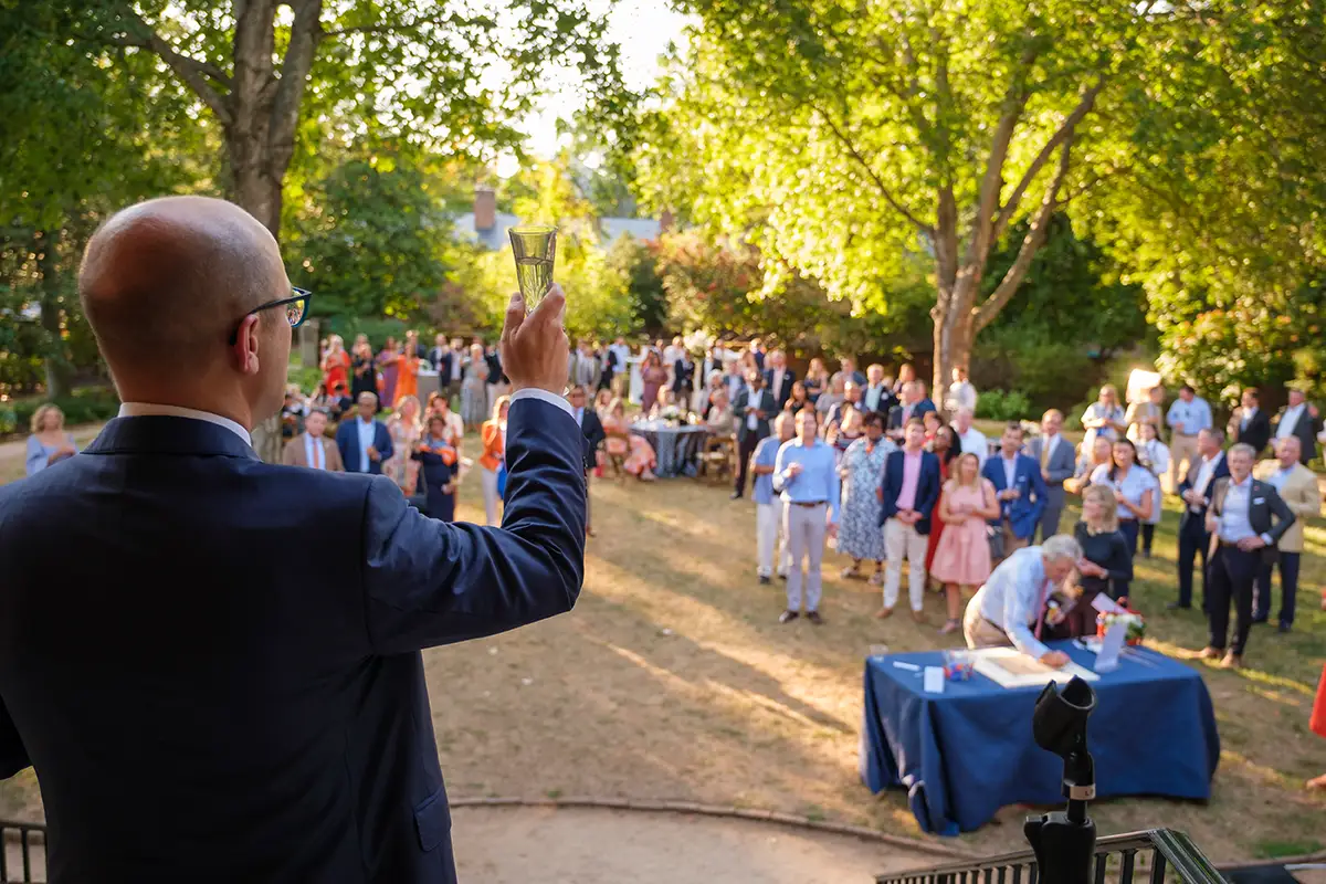 UVA Alumni Association board chair, Thomas Hall, offers a toast to the new Aggarwal Hall.