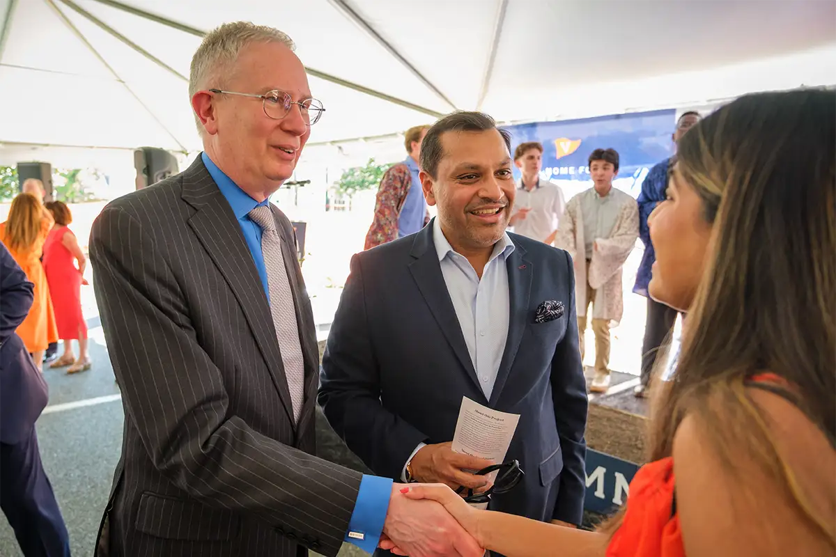 Reggie Aggarwal introduces Interim President Paul Mahoney to his daughter, a first year at UVA.
