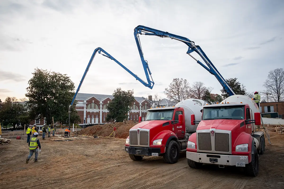 Concrete trucks on site to begin pouring the foundation