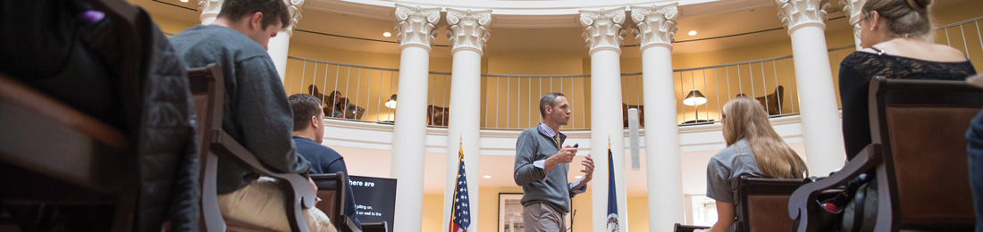 Instructor and class in dome room of the Rotunda