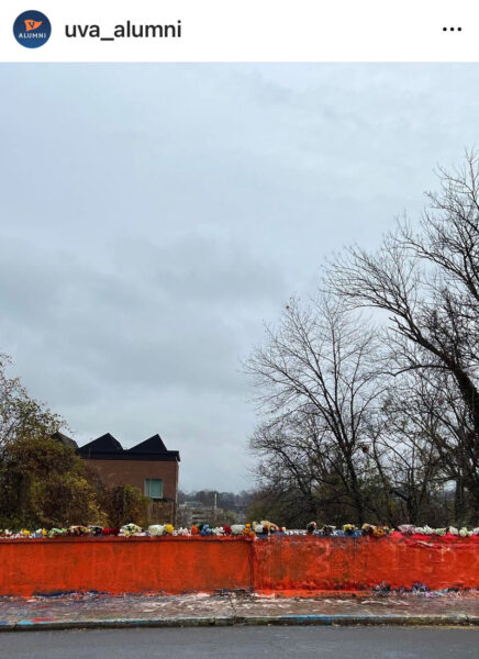 Instagram post from uva_alumni showing Beta Bridge painted orange