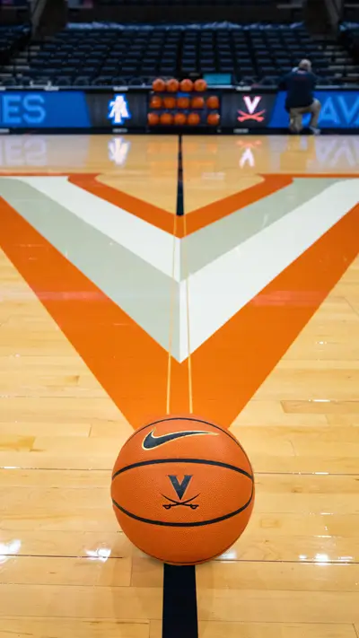 Phone background: Basketball at midcourt of John Paul Jones Arena