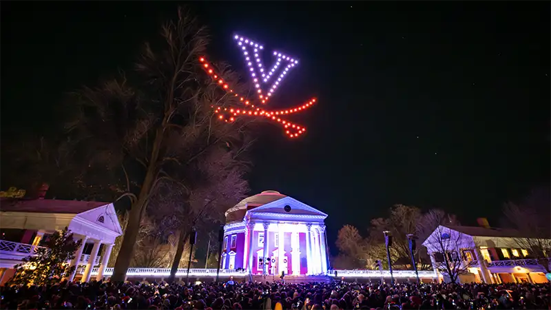 Desktop background: The V-Sabre formed by drones over the Rotunda during Lighting of the Lawn