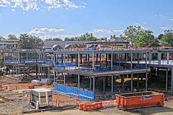 Construction of Aggarwal Hall showing the in-progress steel framing